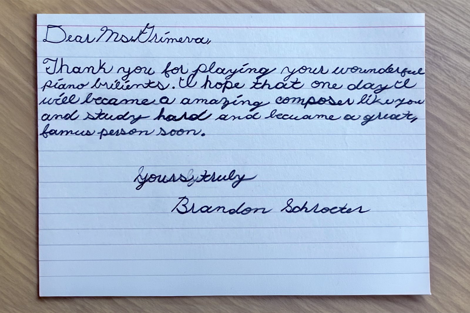A handwritten thank-you letter on lined card from a child named Brandon, thanking Katya for playing and saying he hopes to become a composer like her